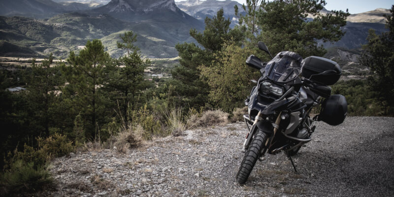 An R1200gs BMW motorcycle in front of the pyrenees mountain